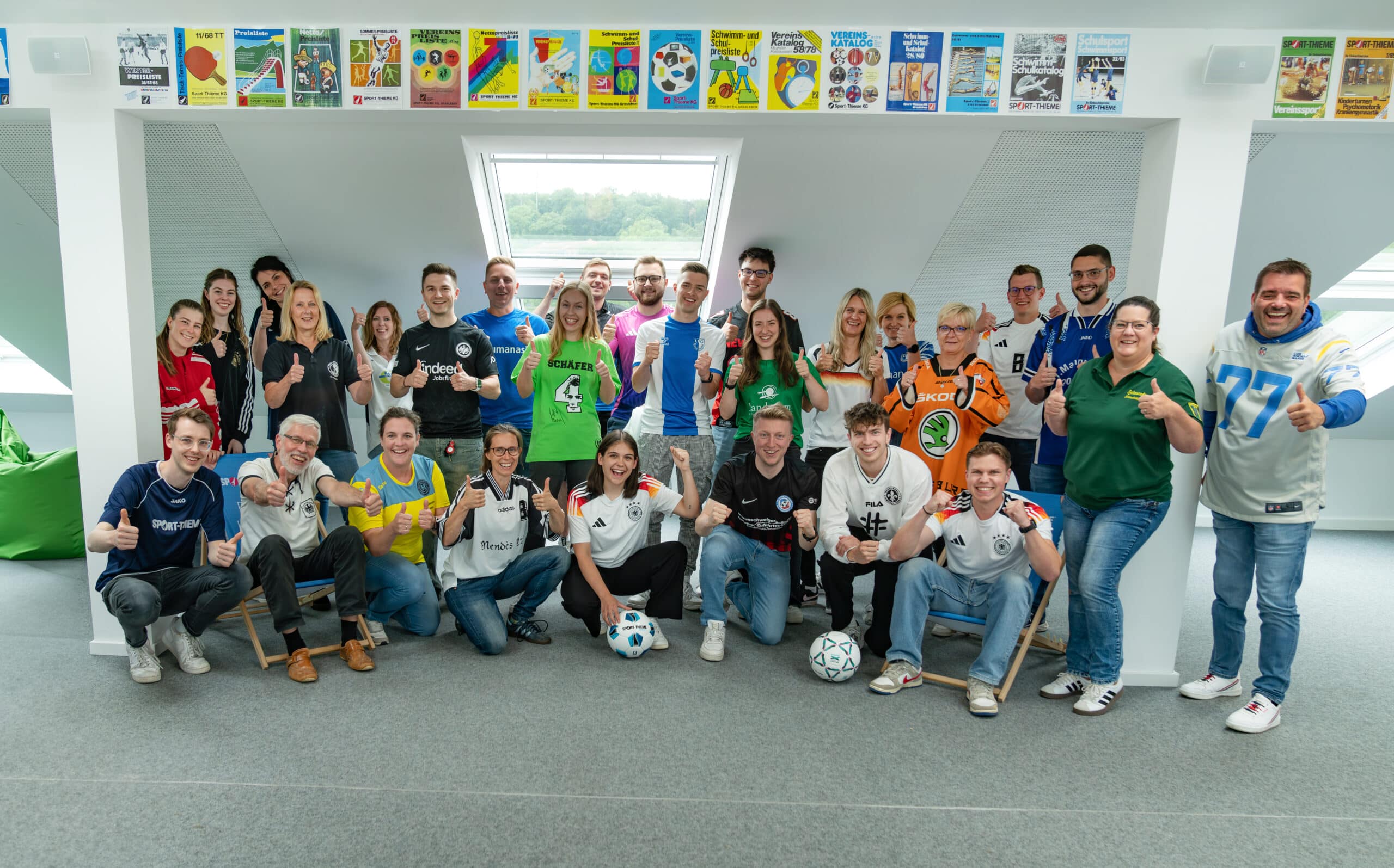 Sport-Thieme employees participating in Trikottag 2024, an initiative by the German Olympic Sports Confederation, proudly wearing their jerseys.
