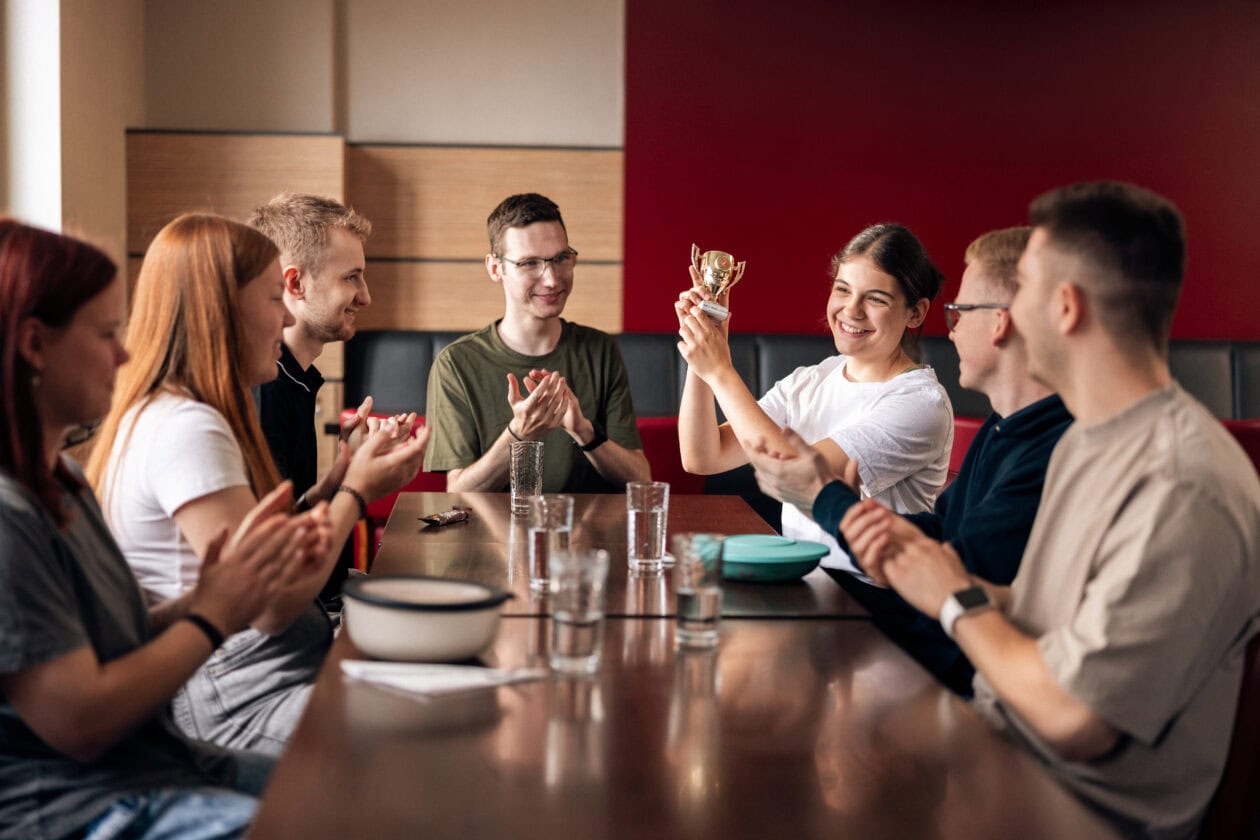 Trainees at lunch with the weekend trophy.