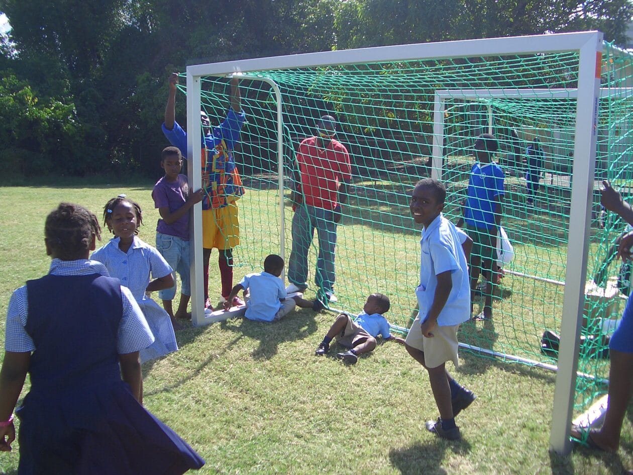 Children playing in a goal