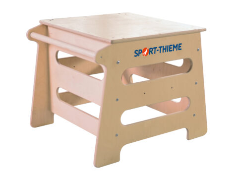 Sport-Thieme wooden podium with grip cutouts and a side bar, versatile for gymnastics and movement exercises.